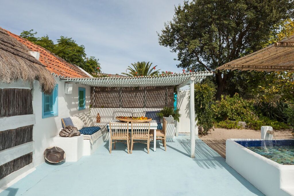 Traditional Comporta al fresco fining for families over looking swimming pool, luxury villa in Comporta, Portugal