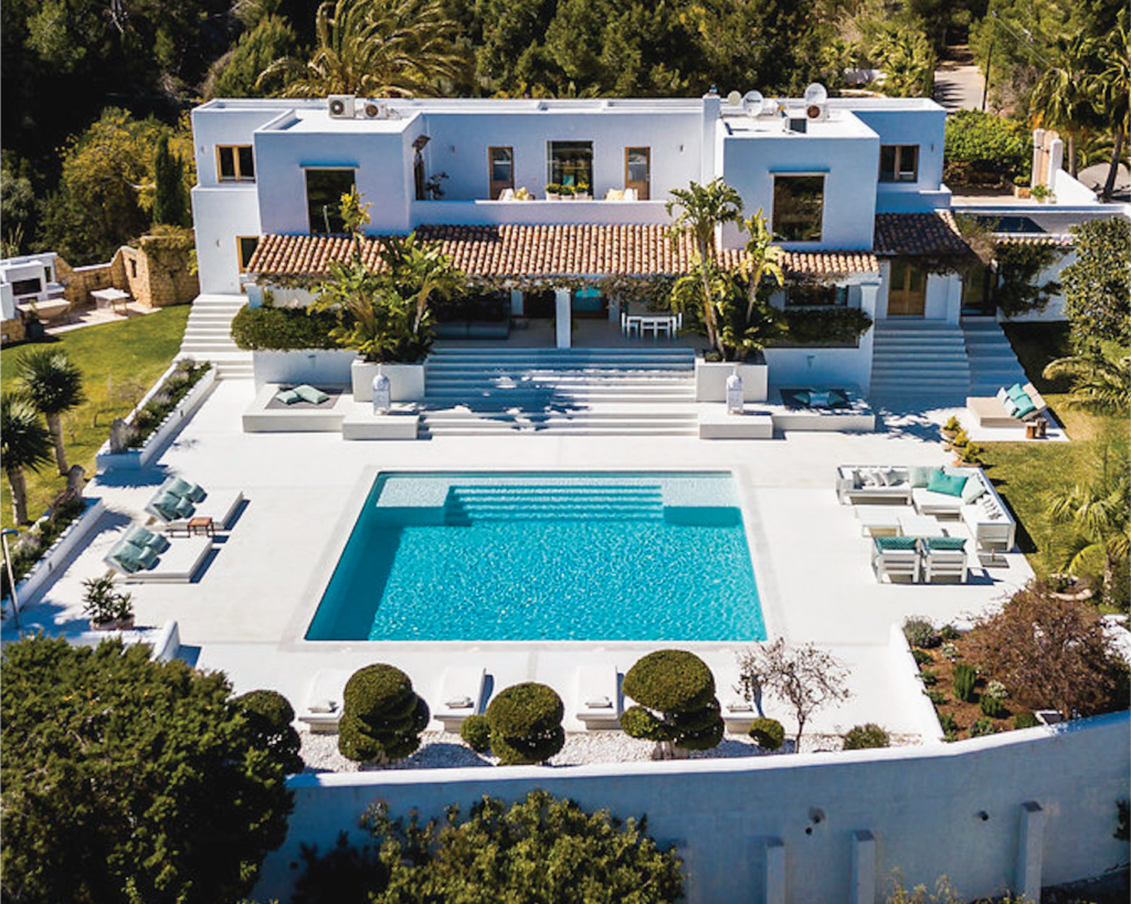 Luxury villa in Ibiza with sparkling swimming pool and ocean views.